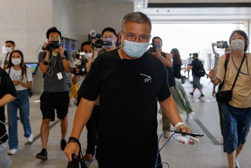 &copy; Reuters. FILE PHOTO: Ronson Chan, chairman of the Hong Kong Journalists Association (HKJA) arrives the West Kowloon Magistrates Courts after been charged with obstructing police, in Hong Kong, China September 22, 2022. REUTERS/Tyrone Siu