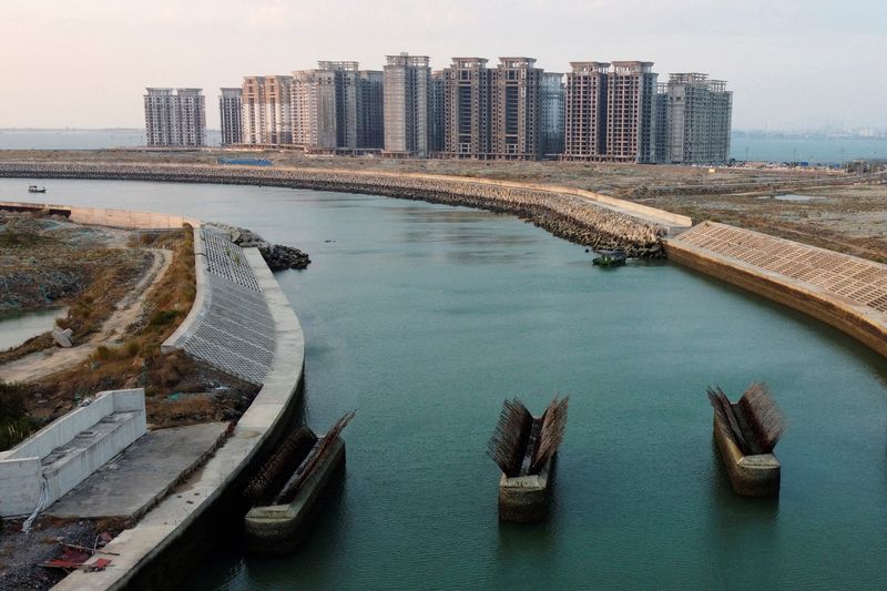 &copy; Reuters. FILE PHOTO: An aerial view shows the 39 buildings developed by China Evergrande Group that authorities have issued demolition order on, on the man-made Ocean Flower Island in Danzhou, Hainan province, China January 6, 2022. Picture taken with a drone. REU