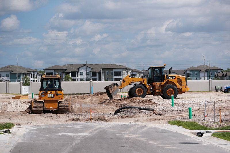 &copy; Reuters. Construction workers break ground to build new homes while building material supplies are in high demand in Tampa, Florida, U.S., May 5, 2021.  REUTERS/Octavio Jones