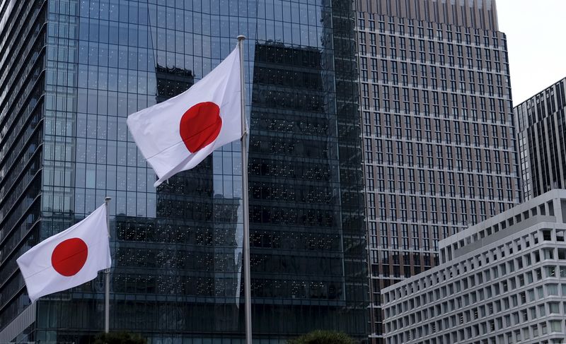 &copy; Reuters. Japanese national flags flutter in front of buildings at Tokyo's business district in Japan, February 22, 2016. REUTERS/Toru Hanai/File photo