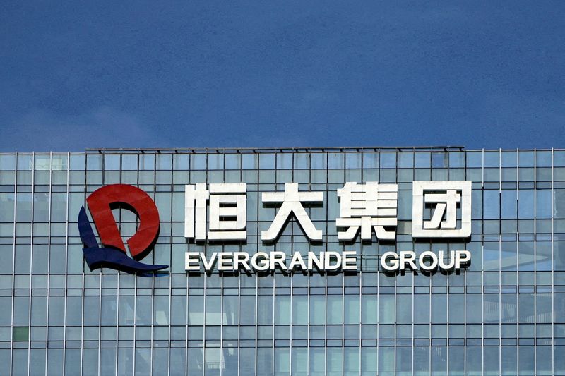 China Evergrande chairman put under police watch; liquidation risk looms