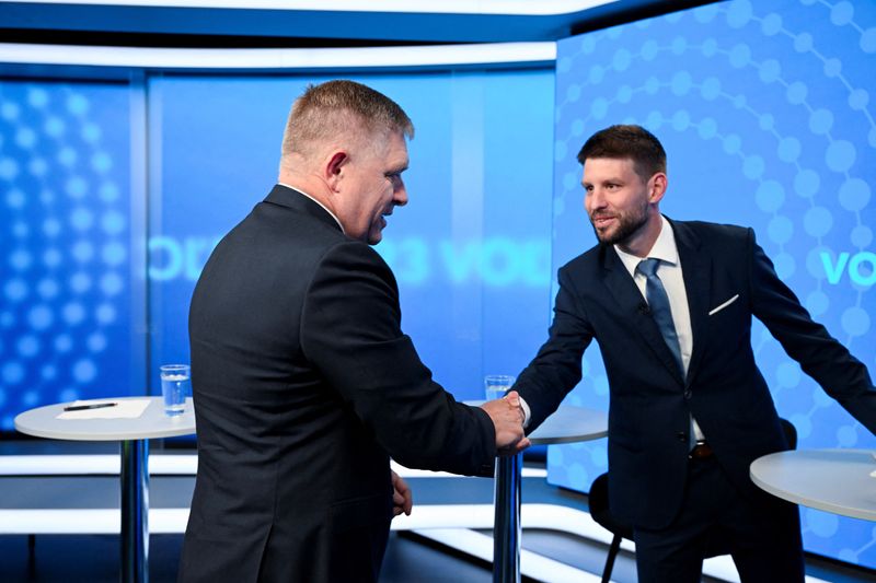 &copy; Reuters. Robert Fico, leader of the SMER-SSD party, and Michal Simecka, leader of the Progressive Slovakia party, greet each other with a handshake before a televised debate at TV TA3, prior to the Slovak early parliamentary election, in Bratislava, Slovakia, Sept