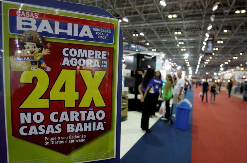&copy; Reuters. FILE PHOTO: Consumers visit the Casas Bahia mega store during opening day in Rio de Janeiro December 4, 2009. REUTERS/Sergio Moraes/File Photo
