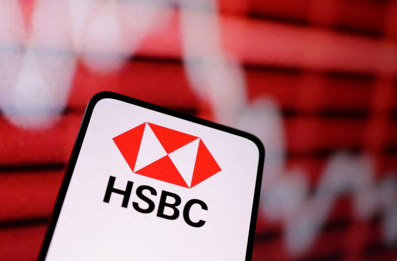 © Reuters. FILE PHOTO: HSBC Bank logo and decreasing stock graph are seen in this illustration taken March 12, 2023. REUTERS/Dado Ruvic/Illustration/File Photo