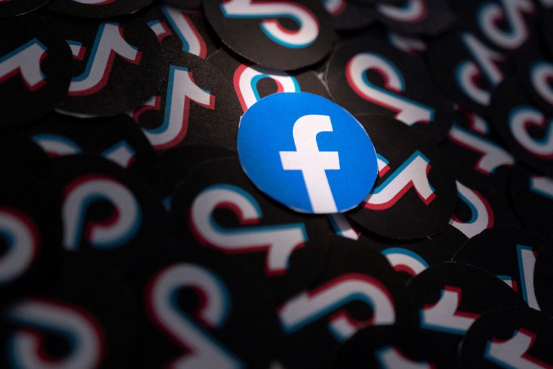 &copy; Reuters. FILE PHOTO: Printed Facebook and TikTok logos are seen in this illustration taken February 15, 2022. REUTERS/Dado Ruvic/Illustration/File Photo