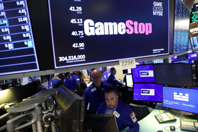 &copy; Reuters. FILE PHOTO: Traders work under signage for GameStop Corp. (NYSE: GME) on the trading floor at the New York Stock Exchange (NYSE) in Manhattan, New York City, U.S., August 8, 2022. REUTERS/Andrew Kelly/File Photo