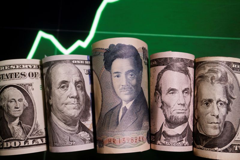 &copy; Reuters. Banconote di yen giapponesi e di dollari statunitensi con un grafico del tasso di cambio in questa foto illustrativa del 16 giugno 2022. REUTERS/Florence Lo/Illustrazione/Foto d'archivio