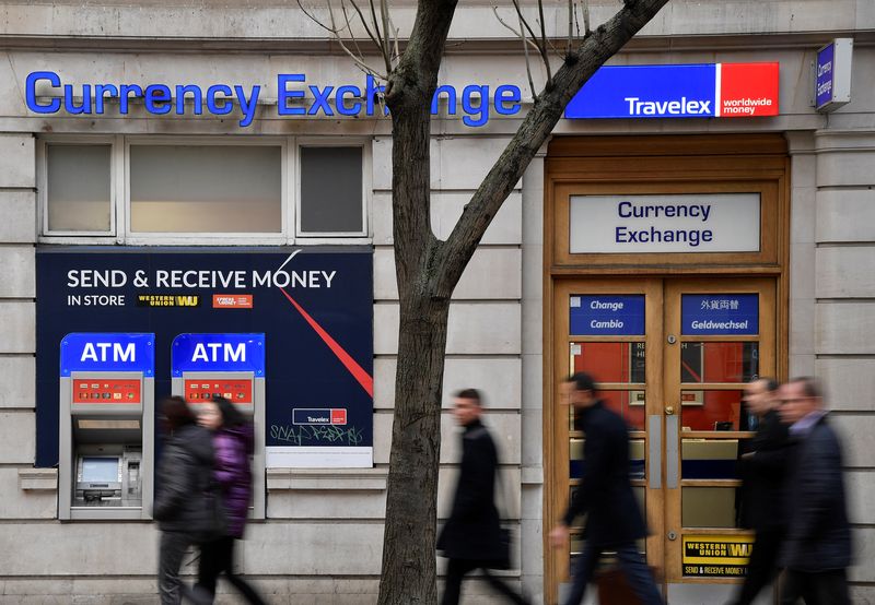 &copy; Reuters. People walk past a branch of Travelex Currency Exchange in London, Britain, January 8, 2020. REUTERS/Toby Melville/File photo