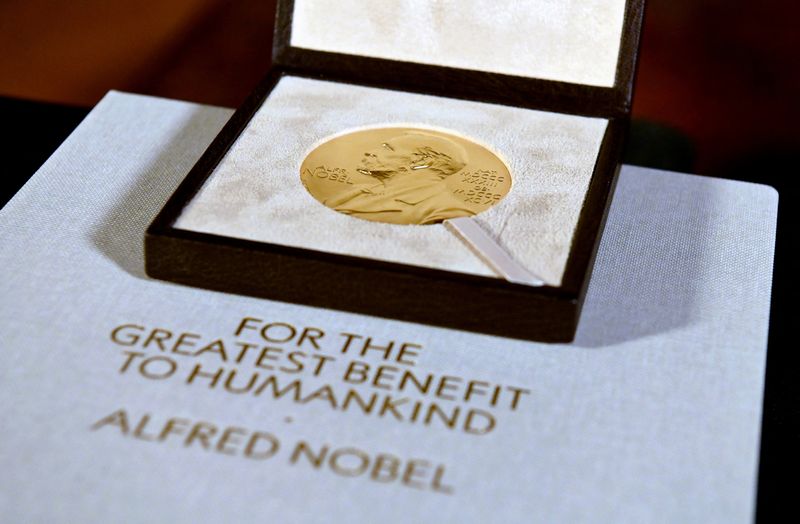 &copy; Reuters. FILE PHOTO: The Nobel Prize medal, presented to Charles M. Rice in Physiology or Medicine, is seen after Swedish Consul General Annika Rembe presented it to him at her residence in New York City, U.S. December 8, 2020. Angela Weiss/Pool via REUTERS/File P