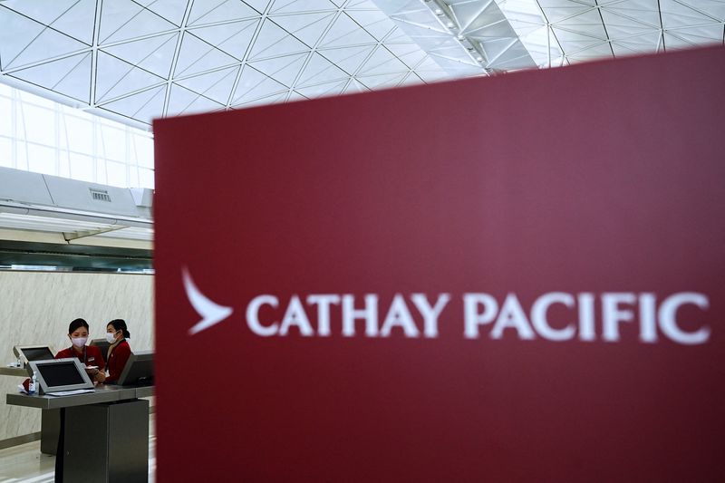 &copy; Reuters. FILE PHOTO: Cathay Pacific employees work at Hong Kong International Airport, in Hong Kong, China March 8, 2023. REUTERS/Lam Yik/File Photo