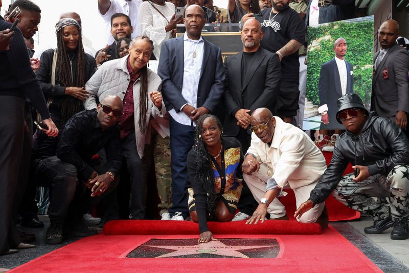 &copy; Reuters. Sekyiwa 'Set' Shakur and Director Allen Hughes pose with the star of Rapper Tupac Shakur during its posthumous unveiling ceremony on the Hollywood Walk of Fame in Los Angeles, California, U.S. June 7, 2023. REUTERS/Mario Anzuoni