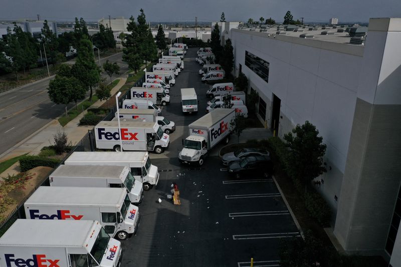 &copy; Reuters. FILE PHOTO: A worker clears debris so delivery vehicles can exit a FedEx Ground distribution center in this aerial photograph taken over Carson, California, U.S., September 16, 2022.  REUTERS/Bing Guan/File Photo