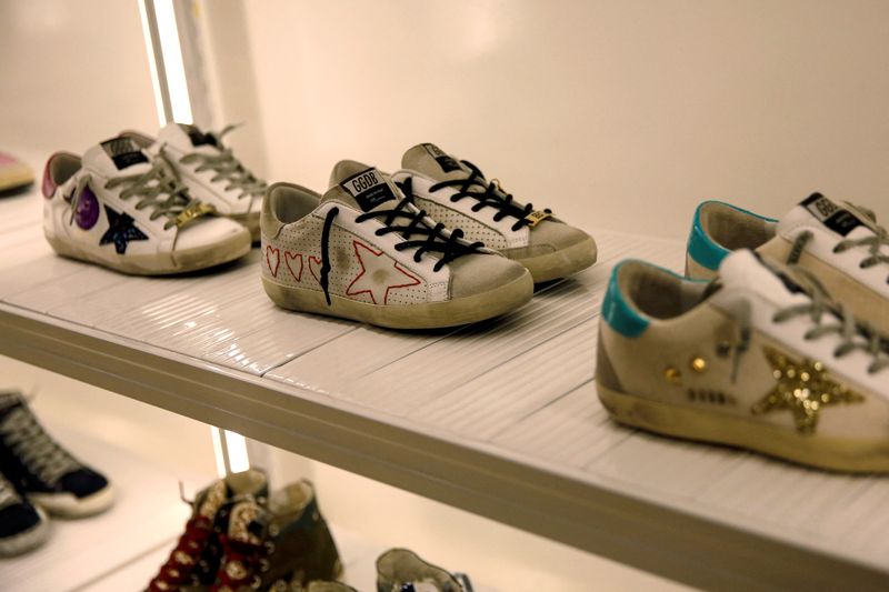 &copy; Reuters. FILE PHOTO: Sneakers of Italian high fashion sneaker brand Golden Goose are displayed at its store in Beijing, China September 23, 2020. Picture taken September 23, 2020. REUTERS/Tingshu Wang/File Photo