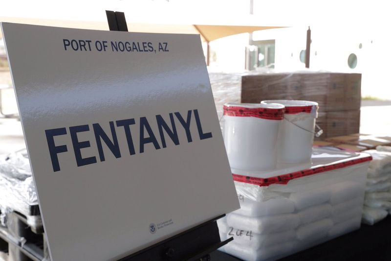 © Reuters. FILE PHOTO: Packets of fentanyl mostly in powder form and methamphetamine, which U.S. Customs and Border Protection say they seized from a truck crossing into Arizona from Mexico, is on display during a news conference at the Port of Nogales, Arizona, U.S., January 31, 2019.   Courtesy U.S. Customs and Border Protection/Handout via REUTERS  