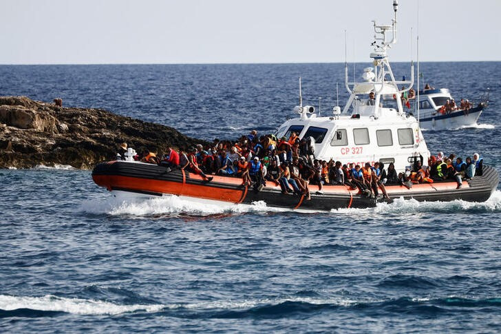 &copy; Reuters. Migrants arrive on an Italian Coast Guard vessel after being rescued at sea, near the Sicilian island of Lampedusa, Italy, September 18, 2023. REUTERS/Yara Nardi/files