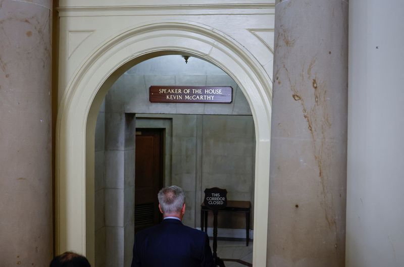 &copy; Reuters. Former Speaker of the House Kevin McCarthy (R-CA) walks back into the office of the Speaker of the House to gather his things after holding a press conference several hours after being ousted from the position of Speaker by a vote of the House of Represen