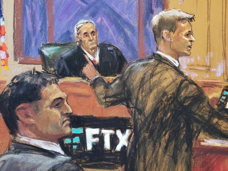 © Reuters. Sam Bankman-Fried watches as Assistant U.S. Attorney Thane Rehn makes his opening remark in Bankman-Fried's fraud trial over the collapse of FTX, the bankrupt cryptocurrency exchange, at Federal Court in New York City, U.S., October 4, 2023 in this courtroom sketch. REUTERS/Jane Rosenberg REFILE - CORRECTING FROM 