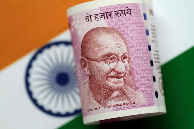 © Reuters. FILE PHOTO: An India Rupee note is seen in this illustration photo June 1, 2017. REUTERS/Thomas White/Illustration/File Photo