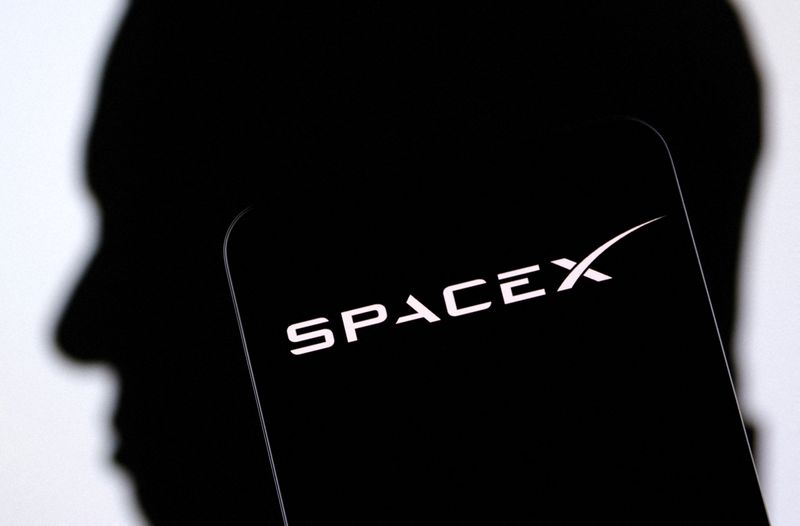 &copy; Reuters. FILE PHOTO: SpaceX logo and Elon Musk silhouette are seen in this illustration taken, December 19, 2022. REUTERS/Dado Ruvic/Illustration//File Photo