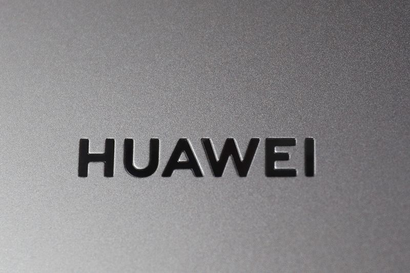 &copy; Reuters. FILE PHOTO: A Huawei logo is seen on a device at a media event in London, Britain, February 18, 2020. REUTERS/Peter Nicholls/File Photo