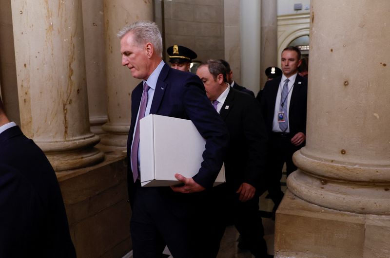 &copy; Reuters. Former Speaker of the House Kevin McCarthy (R-CA) carries a box as he leaves the office of the Speaker of the House and heads out of the U.S. Capitol several hours after being ousted from the position of Speaker by a vote of the House of Representatives o