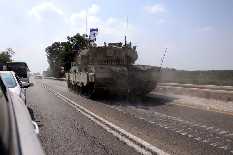 &copy; Reuters. An Israeli tank drives on a road following a mass infiltration by Hamas gunmen from the Gaza Strip, near Sderot in southern Israel October 8, 2023. REUTERS/Ronen Zvulun/File Photo