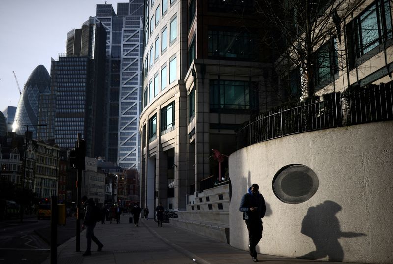 &copy; Reuters. FILE PHOTO: A person walks through the City of London financial district in London, Britain, February 10, 2023. REUTERS/Henry Nicholls/File Photo