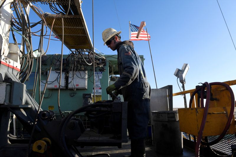 &copy; Reuters. FILE PHOTO: A worker operates equipment on a drilling rig near Midland, Texas, U.S., February 12, 2019. Picture taken February 12, 2019. REUTERS/Nick Oxford/File Photo