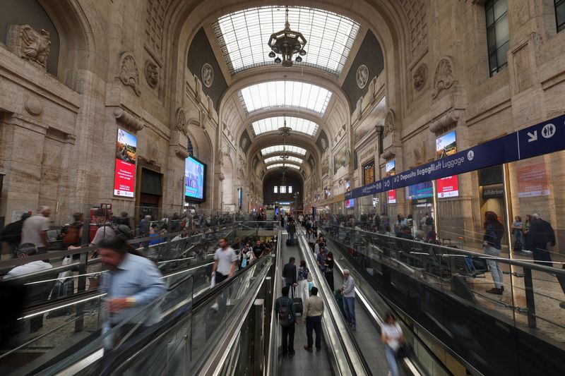 &copy; Reuters. FILE PHOTO: People walk by at the central railway station in Milan, Italy June 9, 2023. REUTERS/Claudia Greco