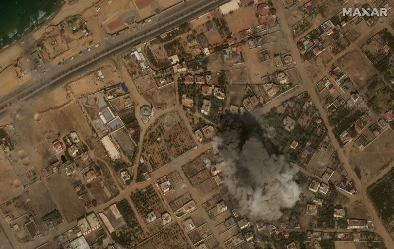 © Reuters. Satellite view of an explosion near the coast of Gaza amid Israeli airstrikes, October 10, 2023 in this handout image. Satellite image Maxar Technologies/Handout via REUTERS