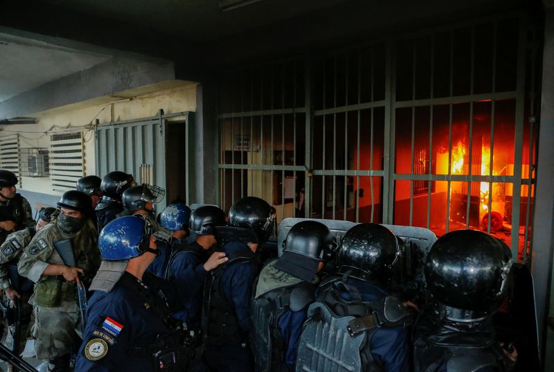 Paraguay's biggest prison set ablaze, rioting inmates take guards hostage
