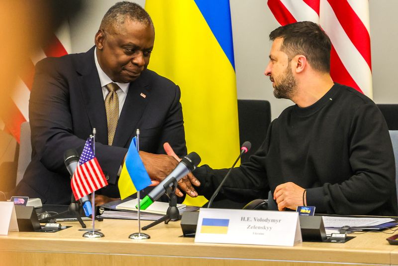 &copy; Reuters. U.S. Secretary of Defense Lloyd Austin III shakes hands with Ukraine's President Volodymyr Zelenskiy during meeting of Ukraine Defense Contact Group ahead of a two day NATO Defense Ministers Council at the alliance headquarters in Brussels, Belgium, Octob