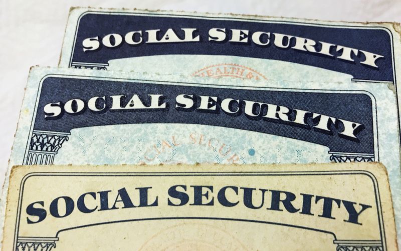 &copy; Reuters. FILE PHOTO: U.S. Social Security card designs over the past several decades are shown in this photo illustration taken in Toronto, Canada on January 7, 2017.  REUTERS/Hyungwon Kang/File Photo