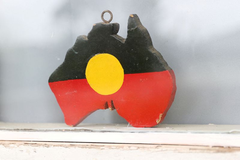 &copy; Reuters. FILE PHOTO: A depiction of the Australian Aboriginal Flag is seen on a window sill at the home of indigenous Muruwari elder Rita Wright, a member of the "Stolen Generations", in Sydney, Australia, January 19, 2021..  REUTERS/Loren Elliott