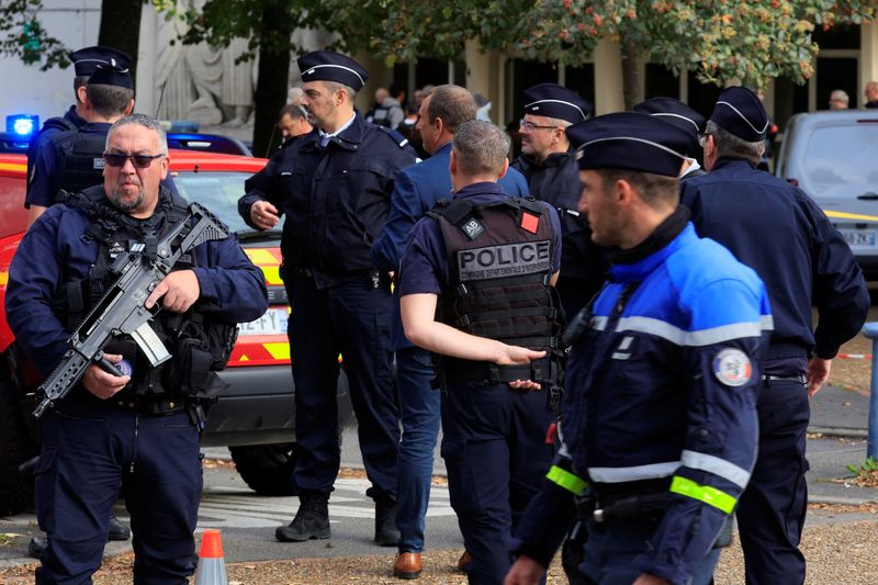 &copy; Reuters. French police secure the area after a teacher was killed and several people injured in a knife attack at the Lycee Gambetta-Carnot high school in Arras, northern France, October 13, 2023. REUTERS/Pascal Rossignol