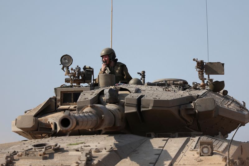 &copy; Reuters. An Israeli tank is seen in the aftermath of a mass infiltration by Hamas gunmen from the Gaza Strip, in Kibbutz Beeri in southern Israel, October 14, 2023. REUTERS/Violeta Santos Moura