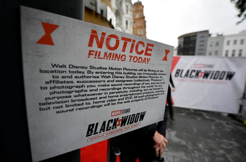 &copy; Reuters. FILE PHOTO: Walt Disney Studios filming notice is placed at the entrance for a special fan event for the Marvel film "Black Widow" in London, Britain, June 29, 2021. REUTERS/Beresford Hodge/File Photo