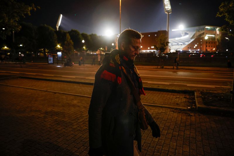 &copy; Reuters. A man walks outside King Baudouin Stadium after the match between Belgium and Sweden was suspended following a shooting in Brussels, Belgium, October 17, 2023 REUTERS/Johanna Geron