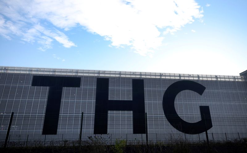 &copy; Reuters. FILE PHOTO: Signage is seen on a THG warehouse building in Manchester, Britain, January 18, 2022. REUTERS/Phil Noble/File photo