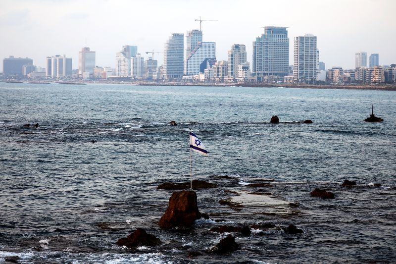 © Reuters. An Israeli flag, attached to a rock known as 