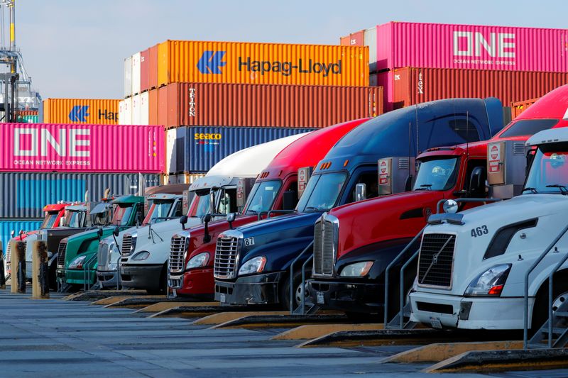 &copy; Reuters. FILE PHOTO: Trucks wait in line as they enter to pick up containers at Yusen Terminals (YTI) on Terminal Island at the Port of Los Angeles in Los Angeles, California, U.S., January 30, 2019.   REUTERS/Mike Blake/File Photo