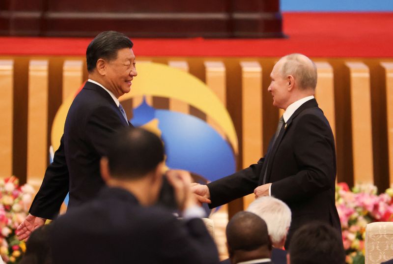 &copy; Reuters. Chinese President Xi Jinping greets Russian President Vladimir Putin as they attend the opening ceremony of the Belt and Road Forum (BRF), to mark the 10th anniversary of the Belt and Road Initiative at the Great Hall of the People in Beijing, October 18,