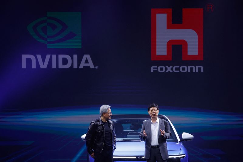 © Reuters. Foxconn Chairman Liu Young-way and Nvidia Corp CEO Jensen Huang speak during Foxconn's annual Tech Day in Taipei, Taiwan October 18, 2023. REUTERS/Ann Wang