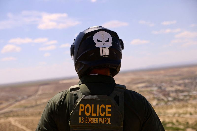 &copy; Reuters. FILE PHOTO: A U.S. Border Patrol agent, wearing a helmet while riding an ATV, searches for migrants trying to enter the United States from the Mexico border, in a desert area in Sunland Park, New Mexico, U.S., August 17, 2023. REUTERS/Jose Luis Gonzalez/F