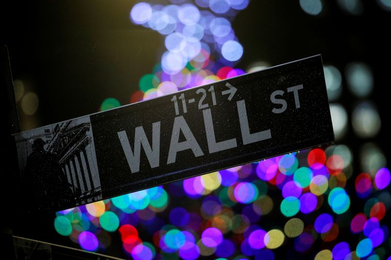 &copy; Reuters. The Wall St. sign is seen outside the New York Stock Exchange (NYSE) in New York, U.S., December 17, 2019. REUTERS/Brendan McDermid