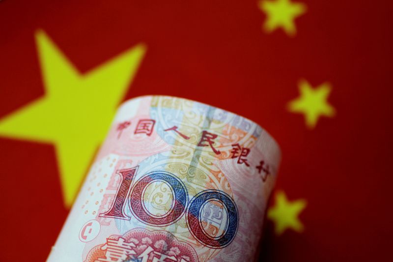 &copy; Reuters. FILE PHOTO: A China yuan note is seen in this illustration photo May 31, 2017. REUTERS/Thomas White/Illustration/File Photo