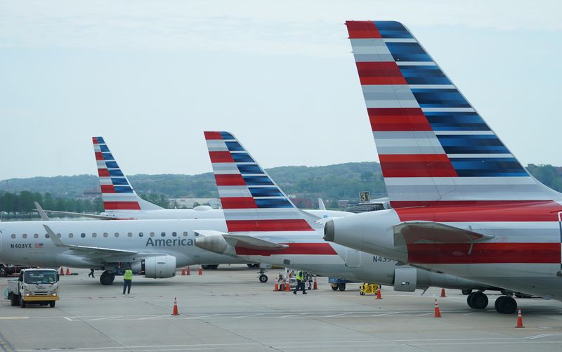 &copy; Reuters. FILE PHOTO: American airlines jets made by Embraer and other manufacturers sit at gates at Washington's Reagan National airport as the novel coronavirus (COVID-19) pandemic continues to keep airline travel at minimal levels and the U.S. economy contracts 