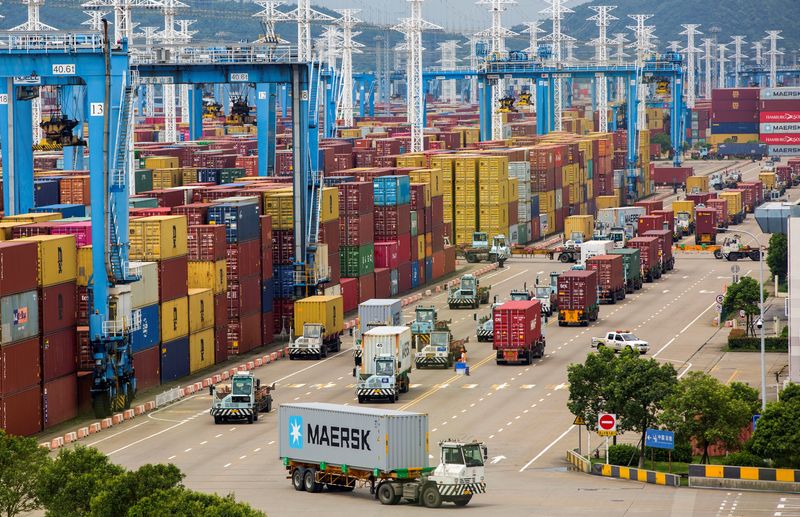 &copy; Reuters. FILE PHOTO: Lines of trucks are seen at a container terminal of Ningbo Zhoushan port in Zhejiang province, China, August 15, 2021. cnsphoto via REUTERS/File Photo