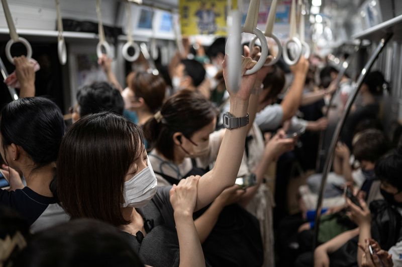 &copy; Reuters. FILE PHOTO: People travel on the subway in Fukuoka, Japan, July 13, 2023. REUTERS/Marko Djurica/File photo