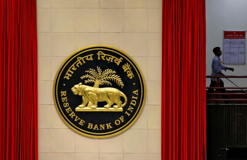 &copy; Reuters. FILE PHOTO: A worker walks past the logo of Reserve Bank of India (RBI) inside its office in New Delhi, India July 8, 2019. REUTERS/Anushree Fadnavis/File Photo